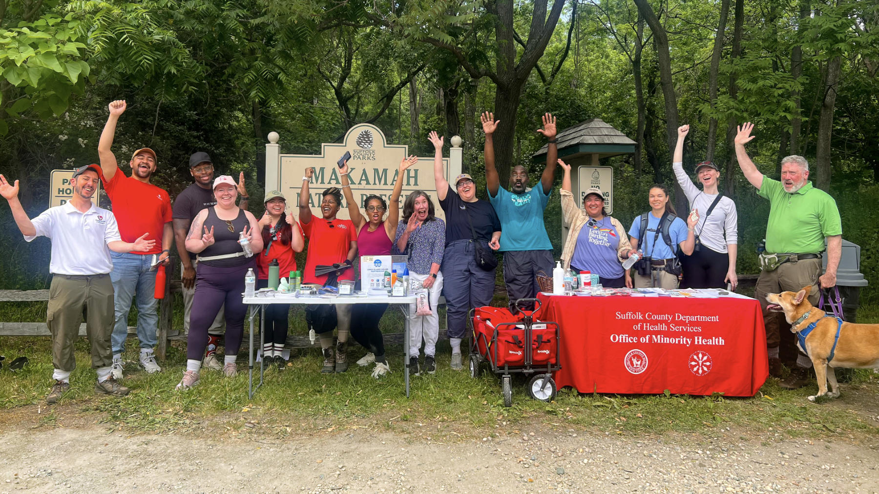 Group from the Suffolk County Office of Minority Health’s Nature Walk program cheering at the Makamah Nature Preserve entrance.